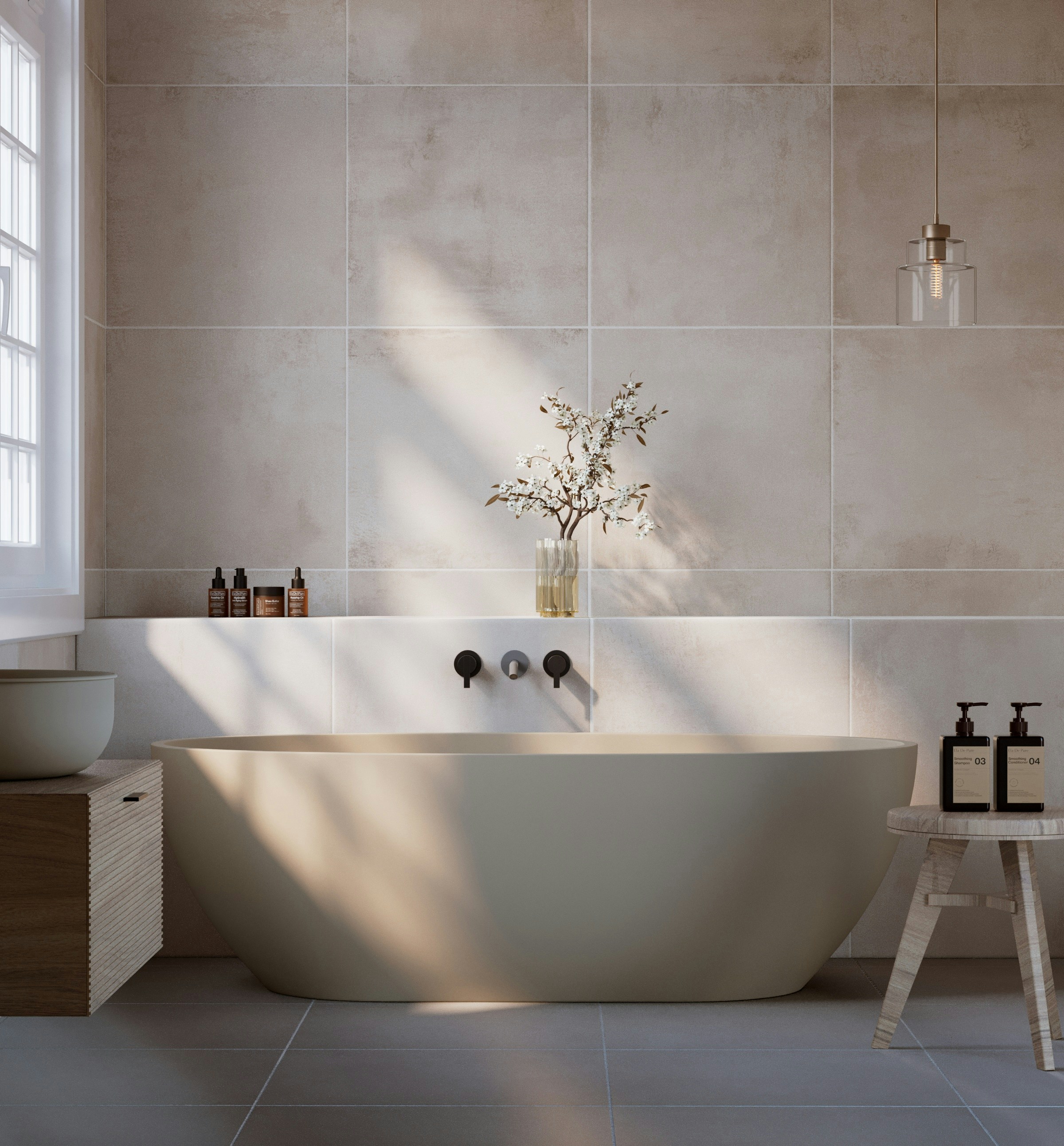 Sculptural bath in a calm stone-lined interior